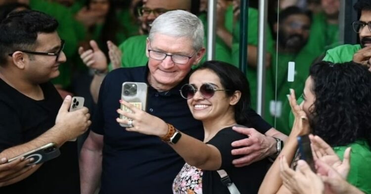 Apple CEO Tim Cook poses for selfies with fans in Mumbai during the opening of Apple's first retail store in India