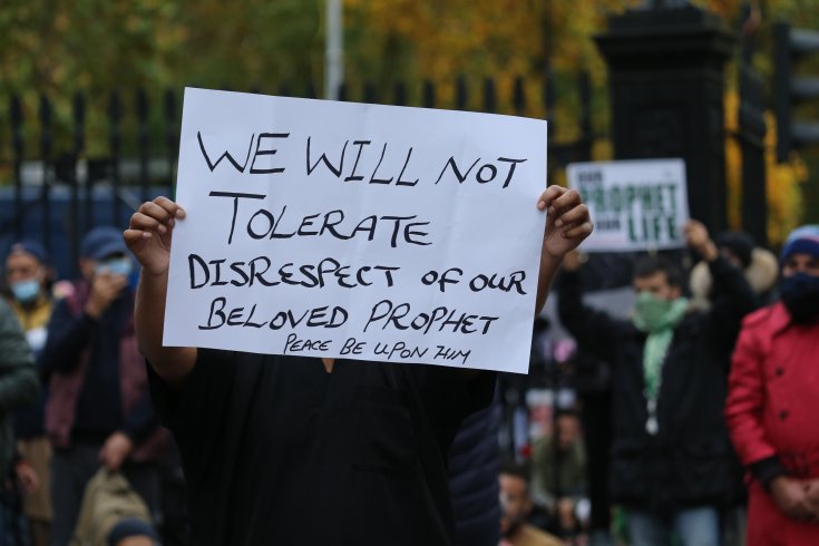 A representation image showing a placard supporting Blasphemy