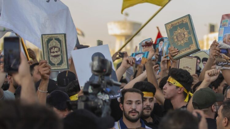 A protest in Tahrir Square, Baghdad by angry Iraqis over desecration of Quran