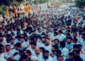 Annamalai in the centre waving hand to the followers during his six month long padyatra