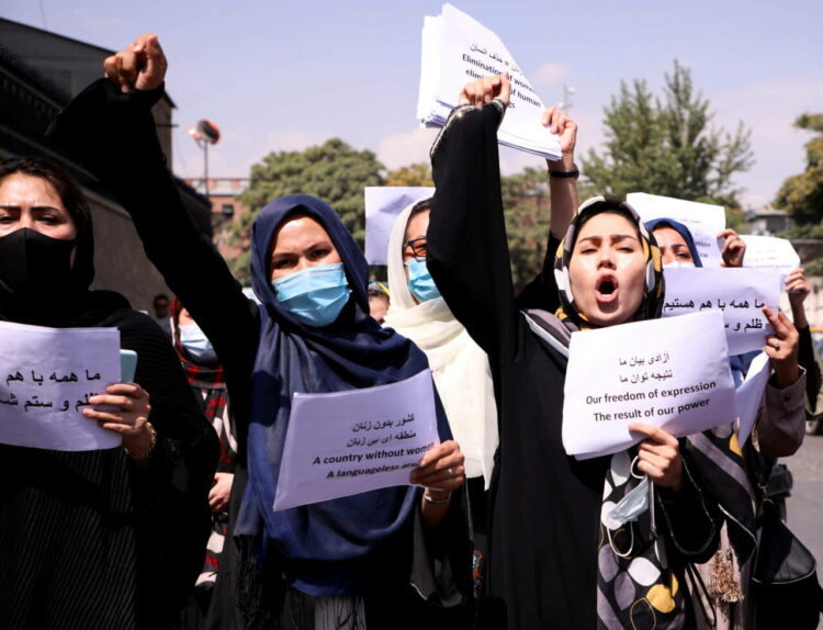 FILE PHOTO: Afghan women's rights defenders and civil activists protest to call on the Taliban for the preservation of their achievements and education, in front of the presidential palace in Kabul, Afghanistan September 3, 2021. REUTERS/Stringer