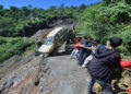 Himachal Pradesh: People try to pull out a car that fell down due to a landslide amid heavy rainfall