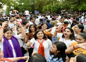 Akhil Bharatiya Vidyarthi Parishad (ABVP) supporters celebrate the winning of ABVP in Delhi University Student Union Election (DUSU) Election 2023 at University Campus in New Delhi on Saturday. (ANI Photo)