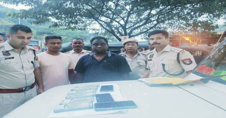 Guwahati Police with the accused involved in fake Indian currency note racket