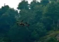 Security forces personnel use a drone during the ongoing encounter