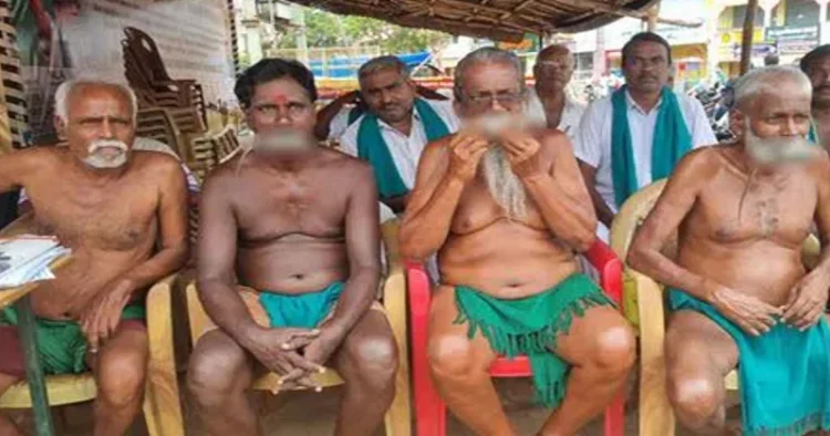Farmers in Trichy, Tamil Nadu holding rats in their mouth as part of their protest