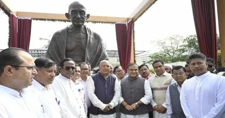 Assam CM Himanta Biswa Sarma with unveiled statue of Mahatma Gandhi at the premises of the new building of the Legislative Assembly in Guwahati