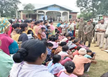 Security personnel with people in the relief camp of Manipur