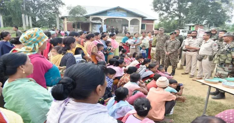Security personnel with people in the relief camp of Manipur
