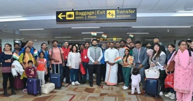 Union Minister of State for Information and Broadcasting and Fisheries, Animal Husbandry & Dairying, L Murugan with the Indian Nationals arrived from Israel at Delhi Airport