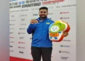 Anish Bhanwala with the medal at 15th Asian Shooting Championship