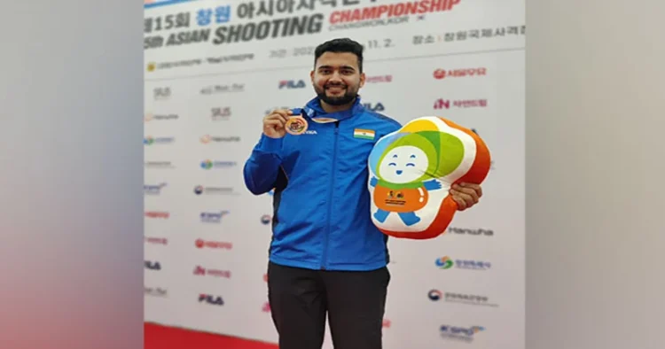 Anish Bhanwala with the medal at 15th Asian Shooting Championship