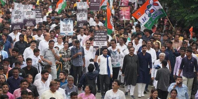 TMC general secretary Abhishek Banerjee with party activists during protest march towards West Bengal Governor house (New Indian Express)