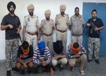 Punjab Police with four of the arrested accused