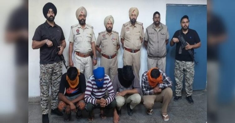 Punjab Police with four of the arrested accused