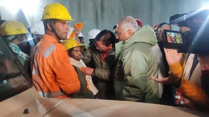CM Dhami with the first worker who was taken out of the tunnel (ANI)