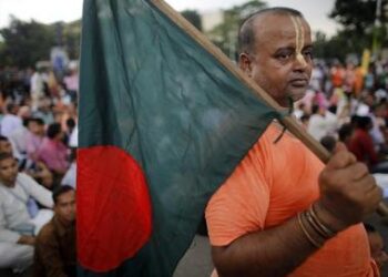 A representation image showing a Hindu man holding the flag of Bangladesh (VNA)