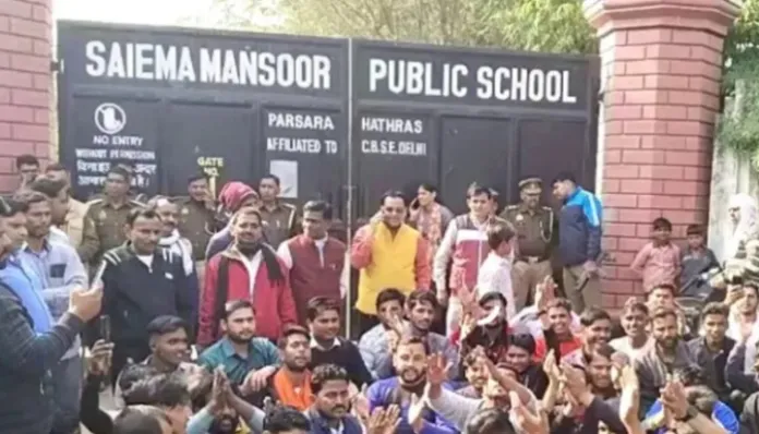 Protestors outside the school (X)