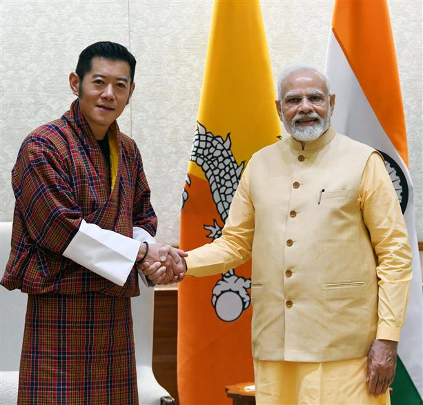 Left: Bhutan King Jigme Khesar Wangchuk, Right: PM Modi (India)