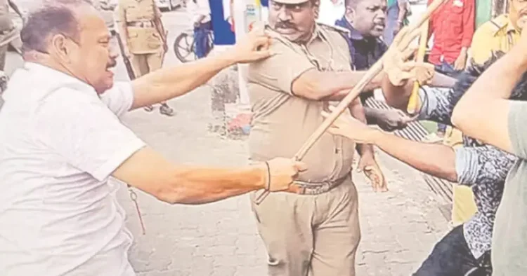 Kerala CM's  gunman beats the protesters
