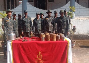 Security personnel with Maoist dump, Image source: Koraput Police