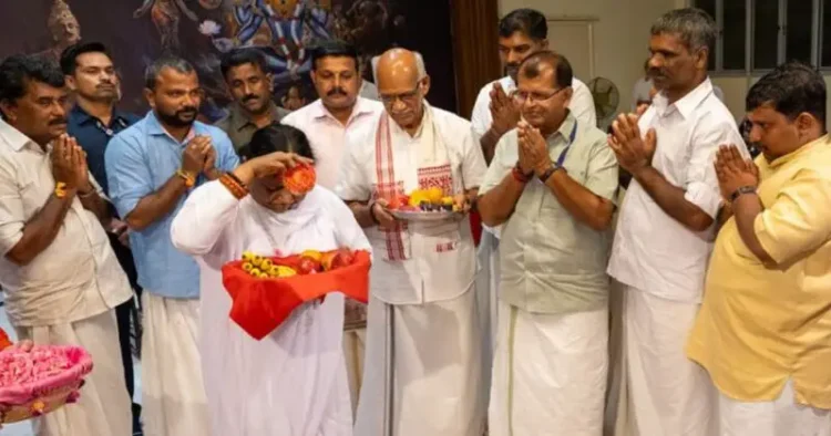 Matha Amritanandamayi Devi receives Rama Mandir Akshata from RSS Pracharak S Sethumadhavan