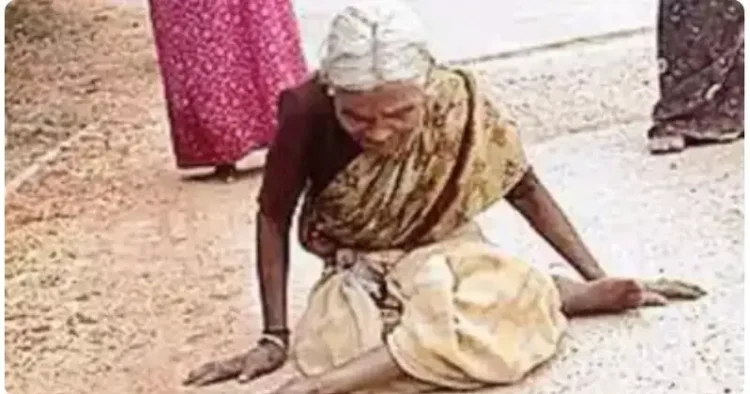 Girijamma, a physically challenged woman, crawls to the post office to get her pension