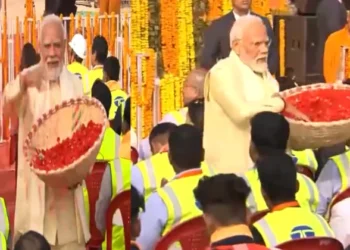 PM Modi showering flower petals on the workers who were a part of the construction team at the Ram Mandir in Ayodhya