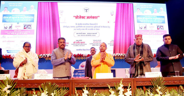 Union Minister Dharmendra Pradhan ,CM Yogi Adityanath and UP Agriculture Minister Surya Pratap Shahi during the inauguration of the modernisation work of PM-SHRI schools in Lucknow