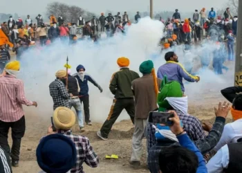 Police use tear gas shell to disperse farmers gathered at the Punjab-Haryana Shambhu border during their 'Delhi Chalo' march (Source: PTI)