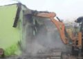 Bulldozers demolishing illegal Madrasa in Haldwani (Image: Telegraph)