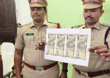 Police officials with fake currency