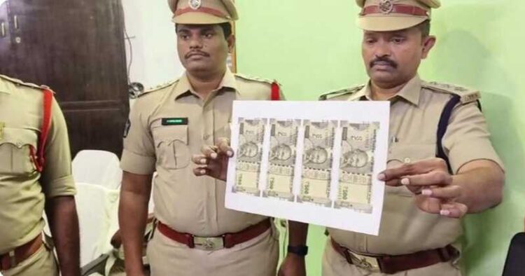 Police officials with fake currency