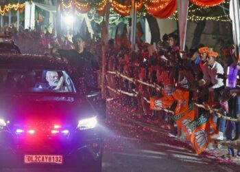 Prime Minister Narendra Modi being welcomed by the people, in Varanasi on Saturday.