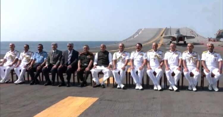 Defence Minister Rajnath Singh along with Naval officers onboard INS Vikramaditya