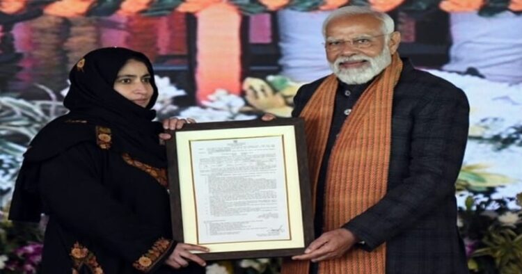 PM Modi distributes an appointment letter during the ‘Viksit Bharat Viksit Jammu Kashmir‘ program