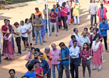 Bengaluru: Voters wait to cast their votes