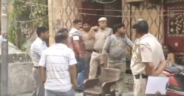 Police gathered outside the house of the victim, image via X/ Swati Goel Sharma