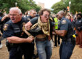 Texas state troopers detain a man at a pro-Palestinian protest at the University of Texas