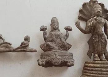 Three bronze statues, believed to be at least 400 years old, depicting Bhagwan Vishnu and Ma Lakshmi, were discovered during the excavation of a plot for a borewell installation in Baghanki village, Manesar (Source: HT)