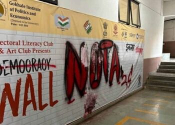 Defaced banner at Gokhale Institute of Politics and Economics