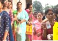 Woman voters standing in a queue to cast their their votes in North east India