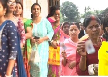 Woman voters standing in a queue to cast their their votes in North east India