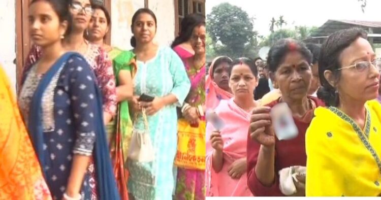 Woman voters standing in a queue to cast their their votes in North east India