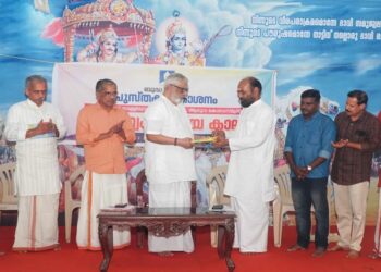 Book release. L/R: K.R. Chandrasekharan, J. Nandakumar, E.N. Nandakumar,  P.E.B. Menon, Brahmachari Narayana Rishi and  E.N. Anil, P.V. Asokan and A.T Santoshkumar of Budha Books.