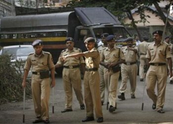 Police officials outside the police station