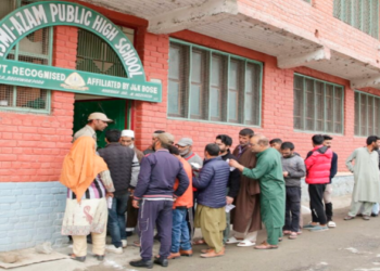 Voters standing in a queue in Srinagar to cast their vote