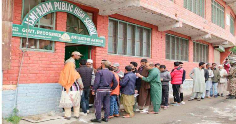 Voters standing in a queue in Srinagar to cast their vote