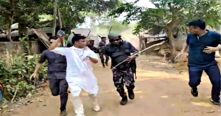 hargram BJP candidate Pranat Tudu running along with security forces to save his life when alleged supporters of TMC pelted stones at him and his security personnel near Garbetta in West Bengal