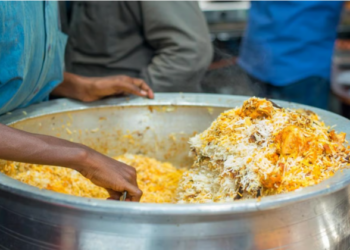 Biryani in a large aluminium utensil